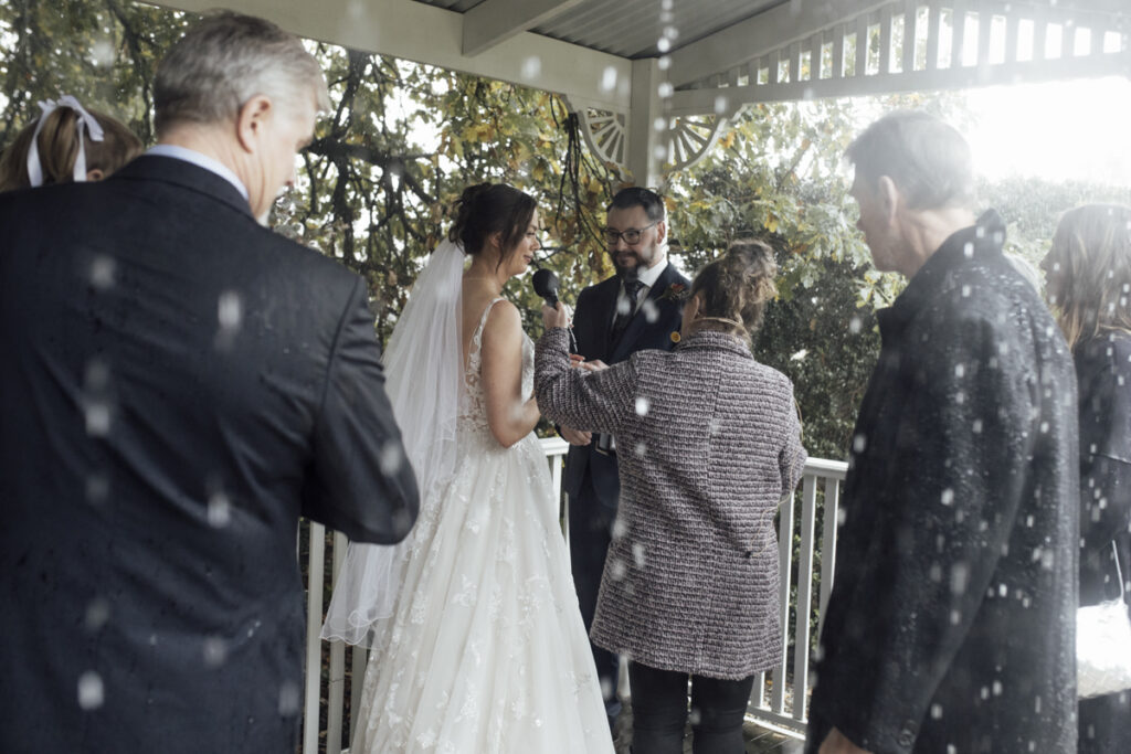 What to do if it rains on your wedding day? a beautiful rainy colour photo of a rainy ceremony